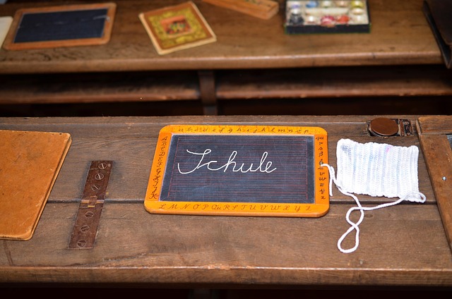 Slate resting on old wooden desk, public domain